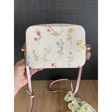 COACH mini camera bag with spaced wildflower print